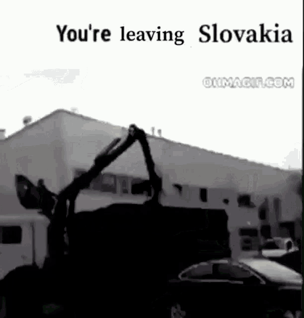 a black and white photo of a truck with the words `` you 're leaving slovakia '' written above it .