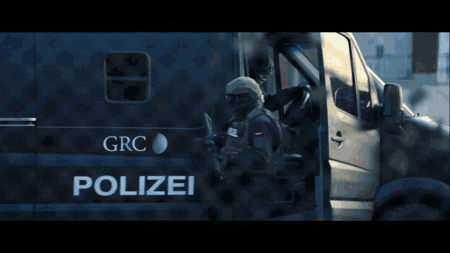 a black van with grc written on the side