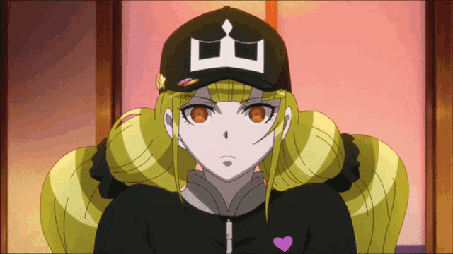 a girl with blonde hair wearing a black hat with a diamond on it