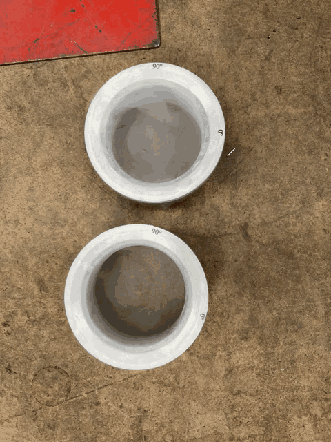 two white circles with 90 degree markings on the bottom