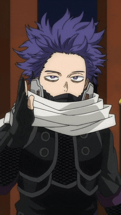 a man with purple hair is wearing a mask