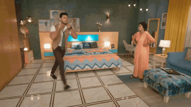 a man and woman are dancing in a bedroom with a bed