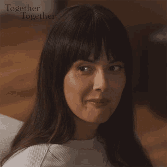 a close up of a woman 's face with the words together together on the bottom