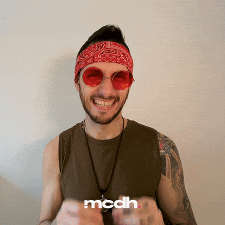 a man wearing red sunglasses and a bandana has the word mcdh on his shirt