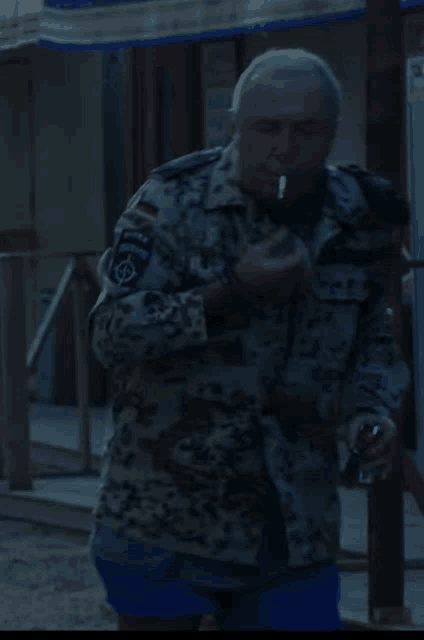 a man in a military uniform has a patch on his arm that says ' bundeswehr '