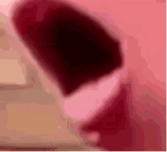 a blurred image of a pink and red background