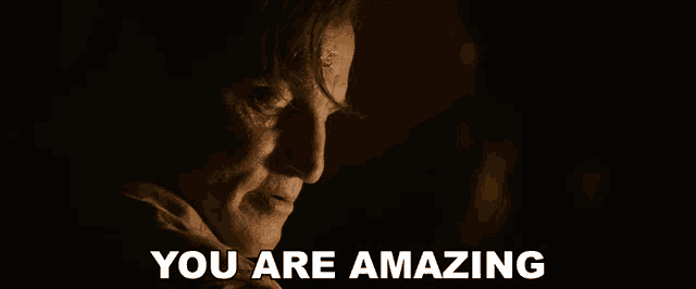 a close up of a man 's face with the words you are amazing below him