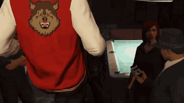 a person wearing a red jacket with a wolf on the back