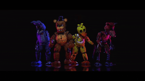 a group of five nights at freddy 's characters are standing next to each other on a stage .