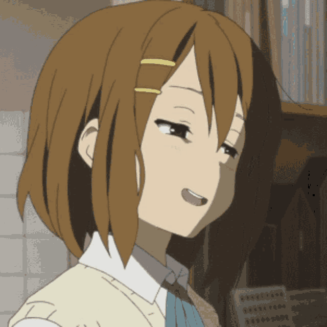 a close up of a girl 's face with her tongue out