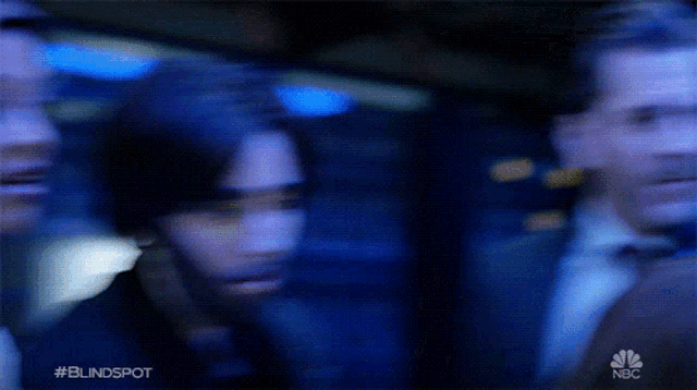 a blurry picture of a group of people with the words #blindspot on the bottom