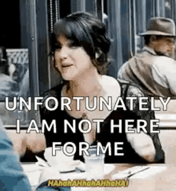 a woman is sitting at a table with a man and says `` unfortunately , i am not here for me '' .