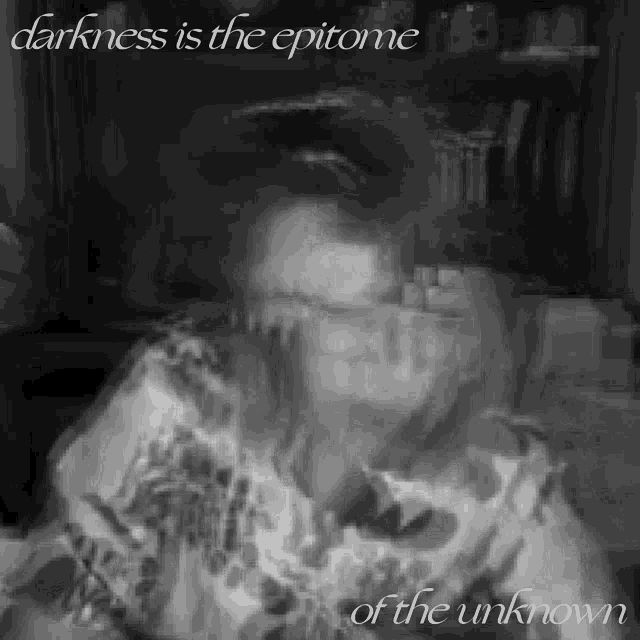 a black and white photo of a person with the words darkness is the epitome of the unknown