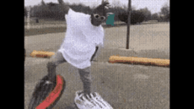 a person wearing sunglasses is riding a skateboard on top of a skateboard .