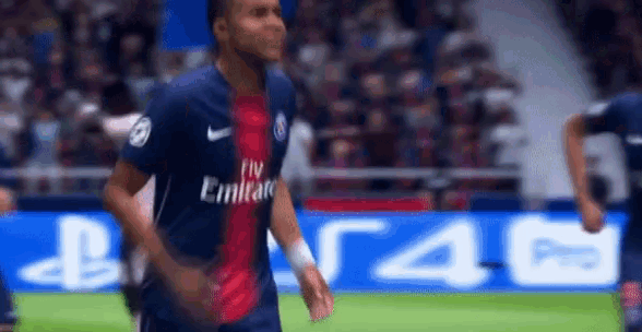 a soccer player wearing a fly emirates jersey is running on a field .