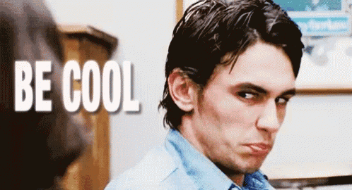 a man is making a funny face in front of the words be cool