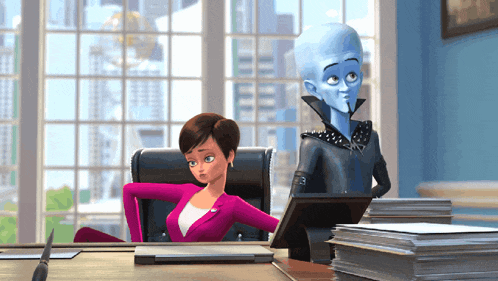 a woman in a pink suit sits at a desk with a man in a black jacket