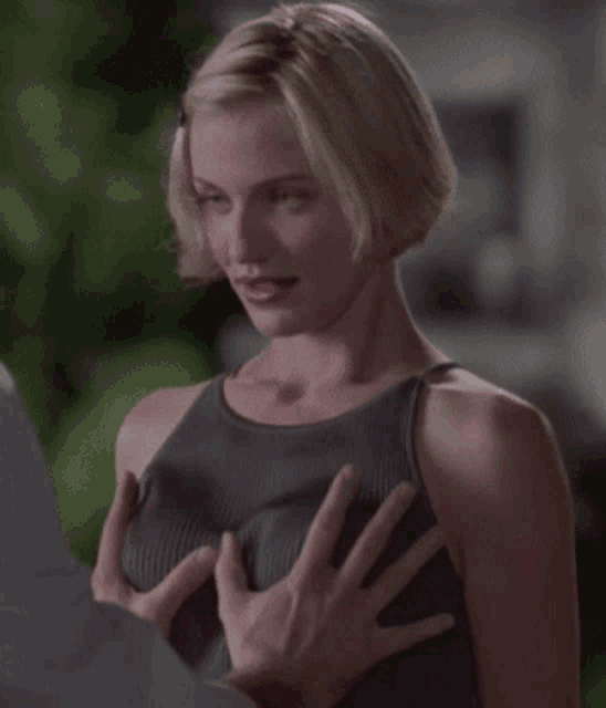 a woman is being touched by a man 's hand