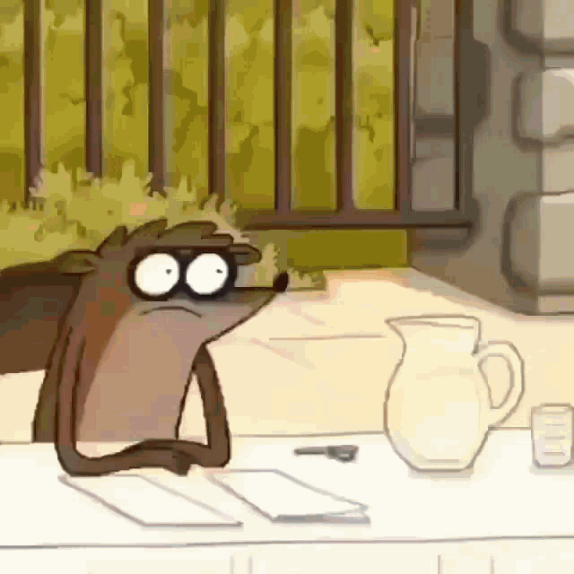 a regular show cartoon character sitting at a table