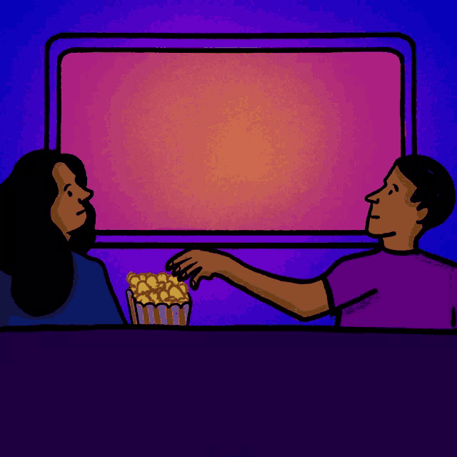 a man is handing a woman a bucket of popcorn in front of a sign that says georgia