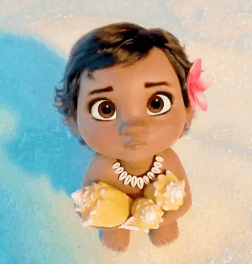 a baby from the movie moana is holding seashells and wearing a necklace .