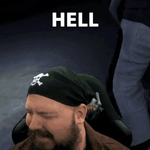 a man with a beard wearing a black headband with a skull and crossbones on it says hell