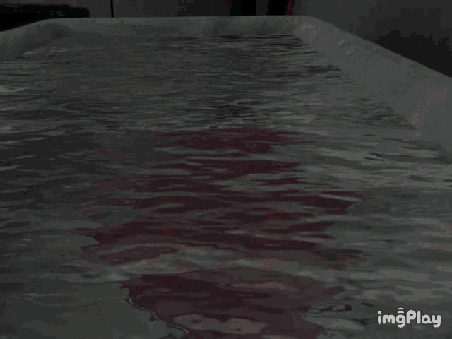 a girl with red hair is taking a bath in a tub with a watermark that says imgplay
