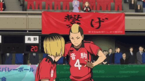 a man wearing a red jersey with the number 4 on it stands next to another man