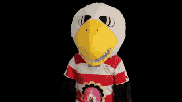 a mascot wearing a red and white striped shirt with legea on the front