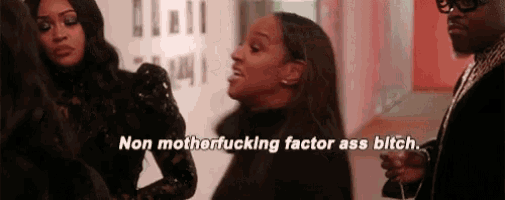 a group of women are standing next to each other and one of them is saying `` non motherfucking factor ass bitch . ''