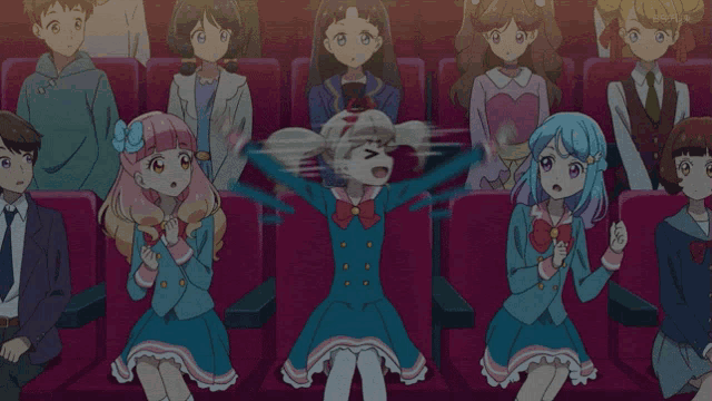 a group of anime characters are sitting in a theater watching a movie