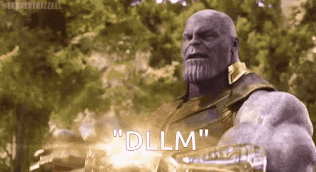 thanos from the movie avengers : infinity war is holding a hammer in his hand and says `` dllm '' .