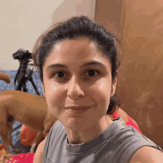 a woman taking a selfie in front of a camera