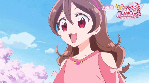 a girl in a pink dress stands in front of cherry blossom trees