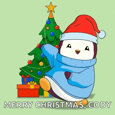 a penguin wearing a santa hat is decorating a christmas tree .