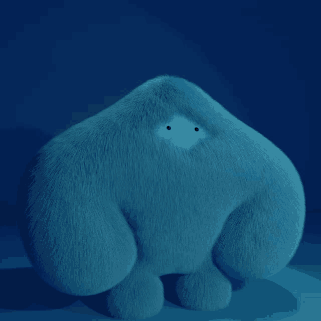 a blue stuffed animal with a white spot in the middle