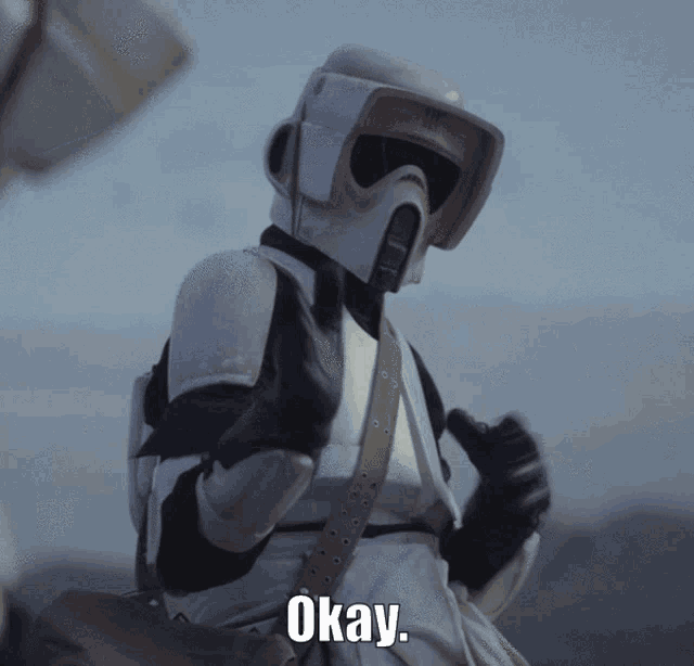 a storm trooper giving a thumbs up with the word okay written below him