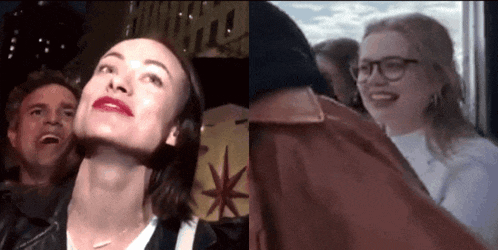 a woman with red lipstick looks up at something in the sky