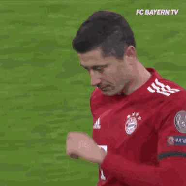 a soccer player wearing a red t-mobile jersey