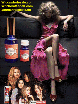 a woman in a pink dress sits on a couch next to a bottle of magical essence of life