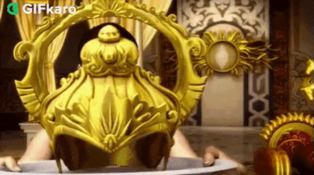 a gold helmet is sitting on top of a white plate in a room .