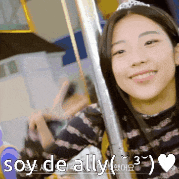 a girl with a tiara on her head is smiling with the words soy de ally written below her