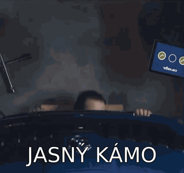 a man is sitting in a chair with the words jasny kamo written on the bottom
