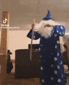 a person dressed as a wizard with a white beard and hat