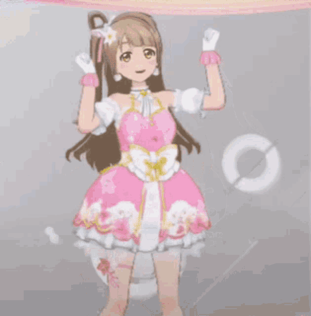 a girl in a pink dress with a flower on her hair