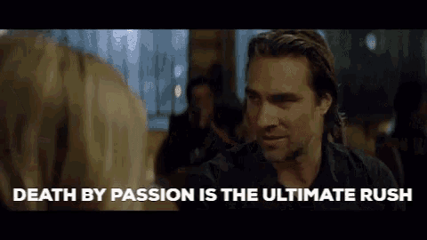 a man is talking to a woman in a movie and the words `` death by passion is the ultimate rush '' are displayed .