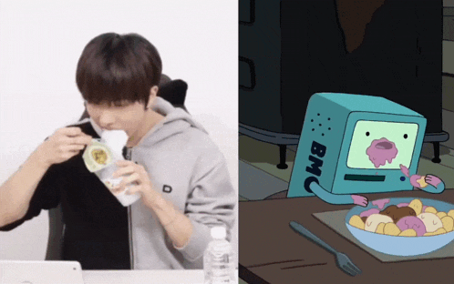 a man eating a sandwich next to a cartoon character with bmo on it