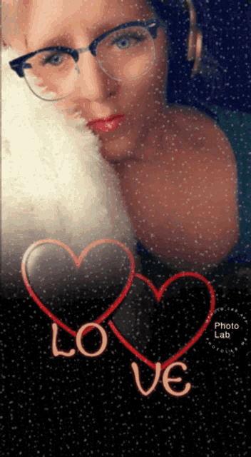 a picture of a woman with glasses and a heart with the word love on it
