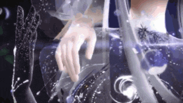 a close up of a person 's hand reaching out towards something .