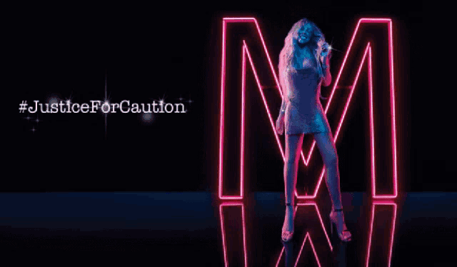 a woman is standing in front of a neon sign that says m